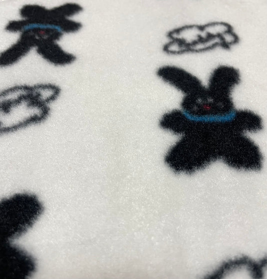 White dog bandana with black rabbit pattern, made from soft natural fabric